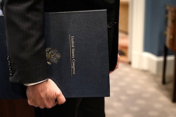 White House Staff Secretary Will Scharf holds the funding bill from Congress that President Donald Trump signed in the Oval Office, officially reopening the government, Wednesday, Nov. 12, 2025. (Official White House photo by Joyce N. Boghosian)