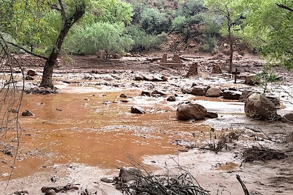 Remnants of stone bridge pylons remain along Bright Angel Creek following a flash flood that destroyed the footbridge on Aug. 29, 2026. The flooding caused significant damage to infrastructure throughout the canyon. (National Park Service photo)