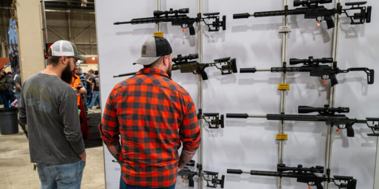 People look at guns and ammunition at the Great American Outdoor Show on Feb. 9, 2024 in Harrisburg, Pennsylvania. (Spencer Platt/Getty Images)