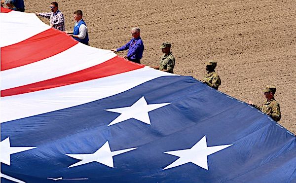 Service members help present the American flag during Military Monday, a community event, at Frontier Park in Cheyenne, Wyoming, July 26, 2021. (U.S. Navy photo by Petty Officer 2nd Class Grant Grady)