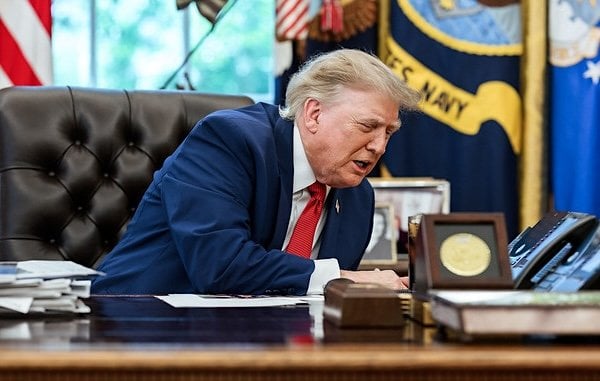 President Donald J. Trump speaks on the phone with freed Russian hostage U.S. Marine veteran Robert Gilman, Tuesday, Aug. 11, 2026, in the Oval Office. (Official White House photo by Joyce N. Boghosian)