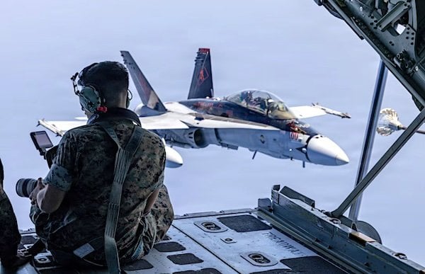 Marine Corps Cpl. Colin Thibault, a combat videographer, records a KC-130J Super Hercules aircraft refueling an F/A-18 Hornet aircraft in the skies off the coast of Japan, Wednesday, Aug. 19, 2026. (U.S. Marine Corps photo by Lance Cpl. David Getz)