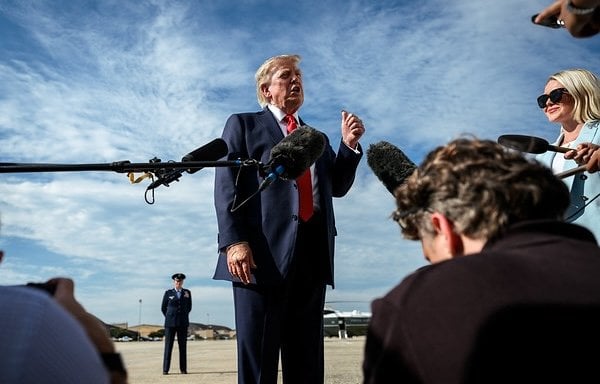 President Donald J. Trump speaks with members of the media alongside outgoing White House Press Secretary Karoline Leavitt, before boarding Air Force One at Joint Base Andrews, Maryland, Friday, August 21, 2026, en route to South Carolina. (Official White House photo by Molly Riley)