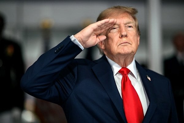 President Donald J. Trump during the National Anthem before the start of the Freedom 250 Grand Prix Race in Washington, D.C., Sunday, August. 23, 2026. (Official White House photo by Daniel Torok)