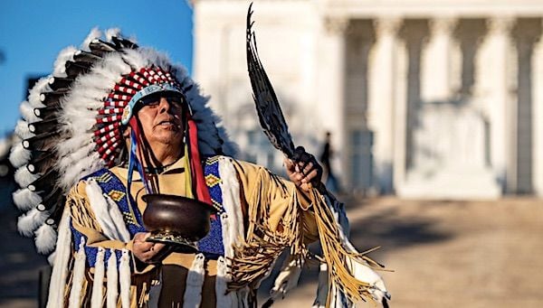 Vincent Goesahead Jr. of the Crow Nation performs with a smudge pot during the opening ceremony for the Tomb of the Unknown Soldier Centennial Commemoration Public Flower Ceremony at Arlington National Cemetery, Arlington, Virginia, Nov. 9, 2021. (U.S. Army photo by Elizabeth Fraser)