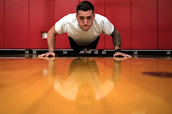 Air Force Senior Airman Jimmy Larkin performs a push-up during a physical fitness test at the Pittsburgh International Airport Air Reserve Station, Pennsylvania, July 29, 2021. (U.S. Air Force photo by Joshua J. Seybert)