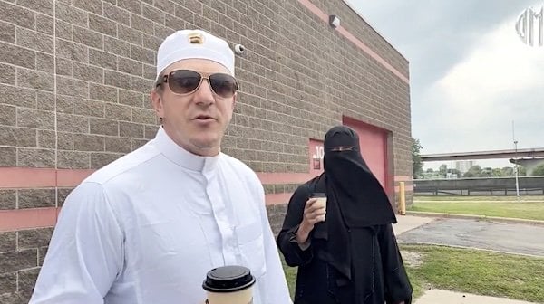 Undercover journalists James O'Keefe and Cam Higby dress as Muslims to expose flaws in Minnesota's voting system in August 2026 (Video screenshot)
