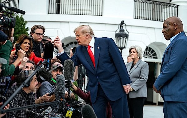 President Donald J. Trump speaks with members of the media alongside Mike Tyson before boarding Marine One on the South Lawn of the White House, Friday, Oct. 9, 2026, en route to Joint Base Andrews for a trip to Syracuse, New York. (Official White House photo by Joyce N. Boghosian)